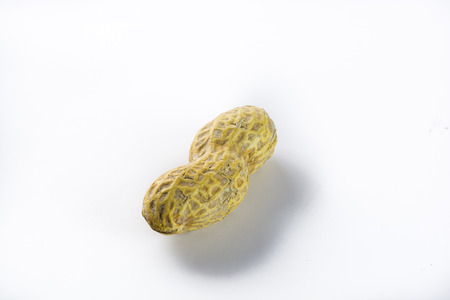 Closeup one peanut on a white background