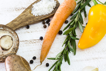 Fresh, ripe vegetables, mushroom, rosemary on a wood.の写真素材