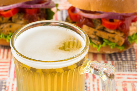 Closeup of mug of beer and sandwiches.の写真素材
