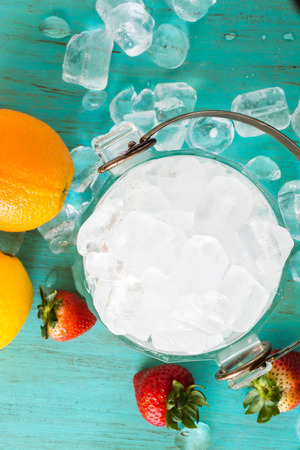 Closeup of glass bucket with ice cubes.の写真素材