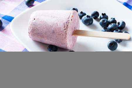 Closeup  of cold breakfast blueberry pops on a plate.の写真素材