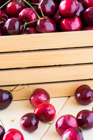 Closeup of cherries in a wood box.の写真素材