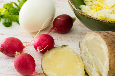 Closeup of chopped eggs, green onion and radish - ingredients for cold soup.の写真素材