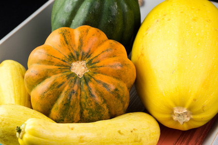 Close up of assorted squash on a tray.の写真素材