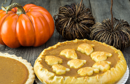Close up of homemade pumpkin pie with crust pumpkin topping decoration.の写真素材