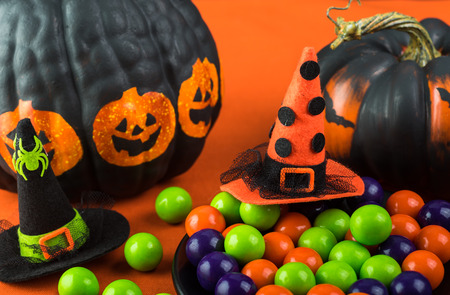 Close up of Halloween candies on a black plate and Halloween decoration.の写真素材