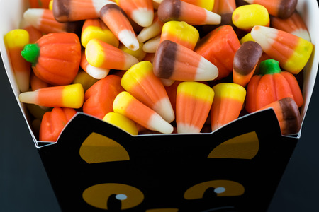 Close up of Halloween candies in treat box.