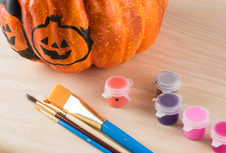 Close up of painting a pumpkin for Halloween.の写真素材