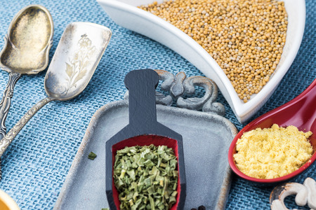 Close up of assorted spices on blue burlap.の写真素材