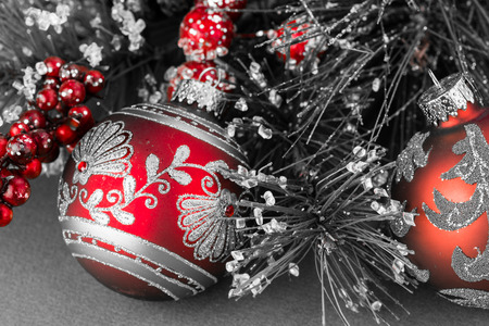 Close up of two kind of Christmas ball ornaments on a green background.の写真素材