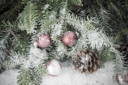 Close up of Christmas ornaments, Christmas tree in snow.の写真素材