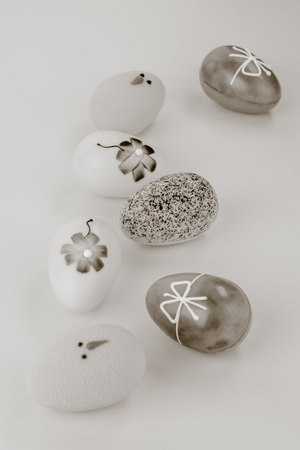 Close up of chocolate easter eggs on pastel wooden background.の写真素材