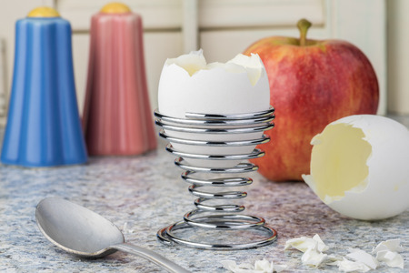 Front view boiled egg in egg stand for breakfast.