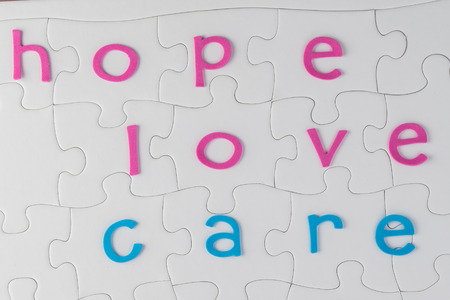 Cancer concept. Puzzle complete with words for support.の写真素材