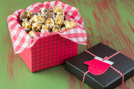 Christmas box with chocolate drizzle caramel corn.の写真素材