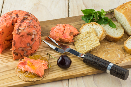 Close up of cutting board with spreadable port wine cheese.の写真素材