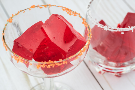 Close up of glass with margarita cocktail jello cubes.の写真素材