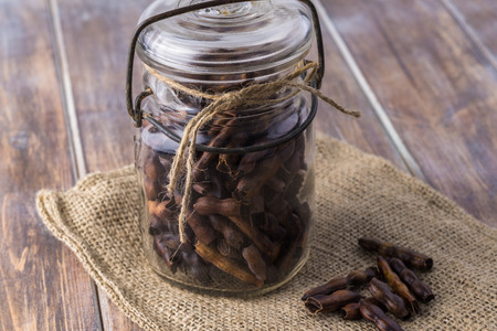 Close up of jar with homemade roasted mesquite bean for delicious coffee.の写真素材