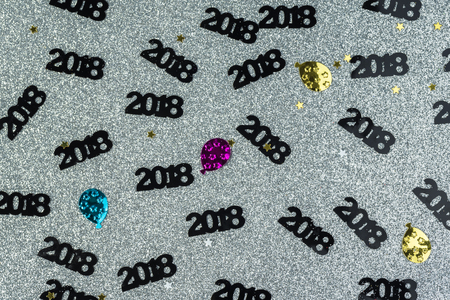 Background New 2018 Year with numbers on silver sparkling paper.の写真素材