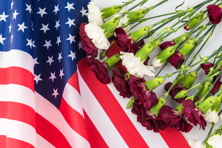 Memorial day greeting card with american flag and flowers.の写真素材