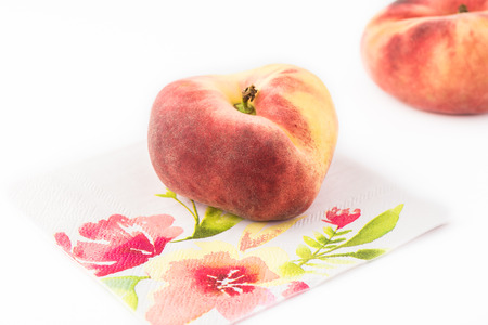 Close up of donut peaches on white background. Selective focus.