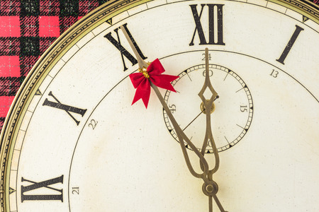 New Year background with vintage clock and hand decorated for holiday.の写真素材