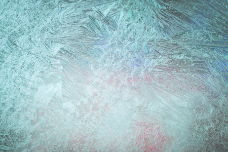 Close up of frosty pattern on the window. Abstract background for Christmas and New Year holiday.の写真素材