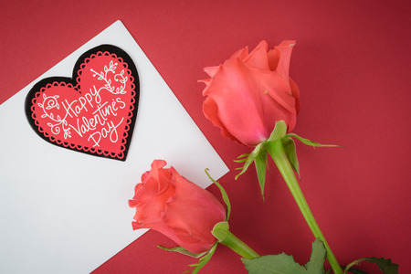 Greeting card for Valentines Day  with roses on a red background.の写真素材
