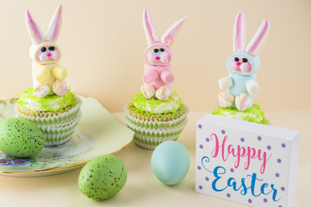 Cupcakes decorated with rainbow marshmallow bunny for Easter.