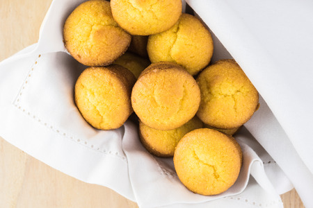 Mini cornbread muffins in a basket.の写真素材