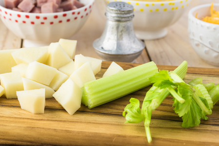 Ingredients for mexican Fiesta soup - potatoes, ham, celery, chedar cheese.の写真素材