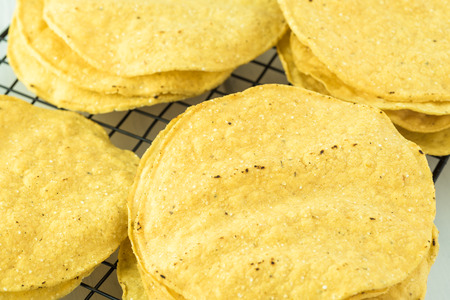 View of corn tostadas on cooling rack.の写真素材