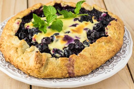 Close up of delicious homemade blueberry cheesecake galette.の写真素材