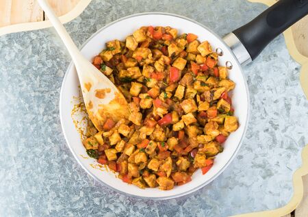 Close up of skillet with enchilada filling for cabbage leaf enchilladas.の写真素材