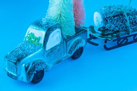Christmas decoration with toy retro truck caring Christmas trees  Greeting card consept. Copy space.の写真素材