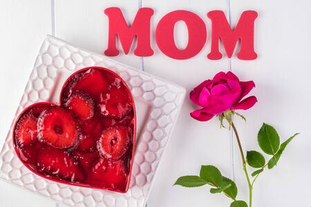 Heart shaped homemade strawberry pretzel salad for Mothers Day. Greeting card consept.の写真素材