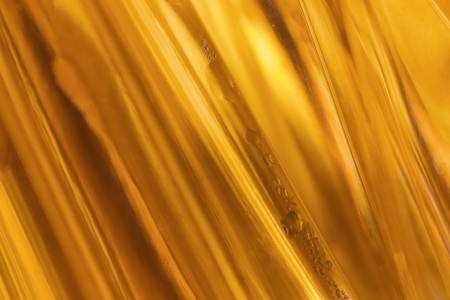 close-up shot of abstract golden glass bachgroundの写真素材