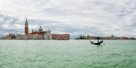 Gondolier near the island of San Giorgio Maggiore, Venice, Italyの写真素材