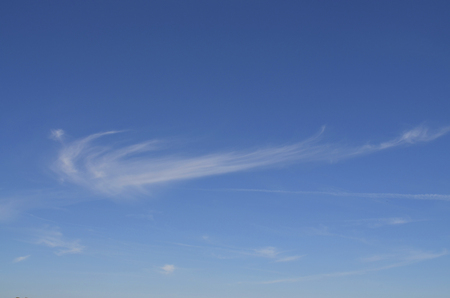 Blue sky with delicate cloudsの写真素材