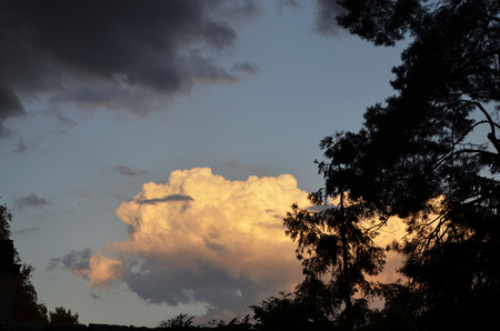 Stormy weather front 	illuminated from sun