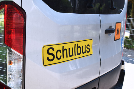 Close-up of signs on a school bus for handicapped children in Germany