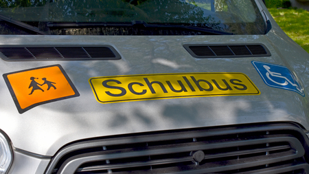 Close-up of signs on a school bus for handicapped children in Germany