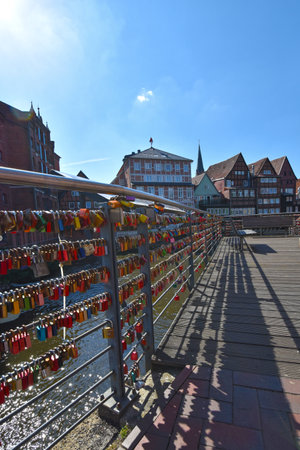 Lueneburg, Germany - June 5, 2018: Countless, colorful love padlocks hanging on a railing at the river Ilmenau in Lueneburg, Germanyのeditorial素材