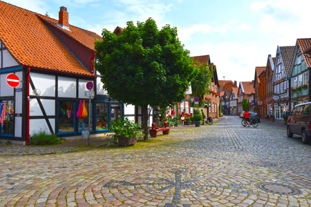 Hitzacker, Germany - June 3, 2018: View to the German medieval town Hitzacker. You see the facades of half timbered and facades of bricks with small shops.のeditorial素材