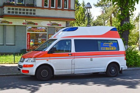 Berlin, Germany - May 4, 2018: Ambulance in a Berlin street in front of a bakeryのeditorial素材