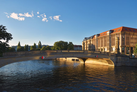 Berlin, Germany - June 30, 2018: River Spree, the Friedrichs-Bridge and the facade of the Humboldt University Berlin in the evening sun.のeditorial素材