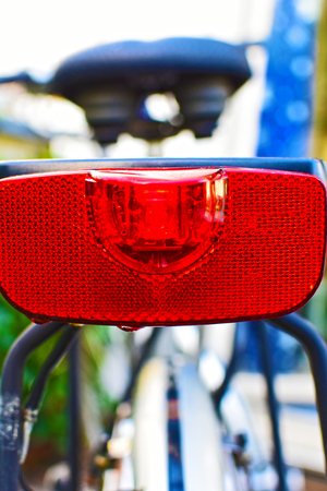 Taillight of a bicycle. In the background you can see the bicycle saddle blurred.の写真素材