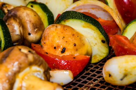 Healthy barbecue alternate with vegan skewers with mushrooms and different vegetablesの写真素材