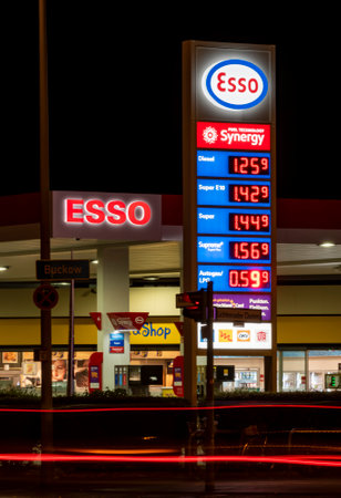 Berlin, Germany - September 20, 2018: Night shot of the price board from a gas station with red...