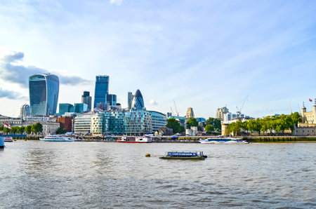 London, Great Britain - August 1, 2015: View over the River Thames on modern skyscrapers next to the...